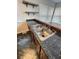 Kitchen with granite countertops, stainless steel sink, and open shelving at 11449 E 1St Ave, Aurora, CO 80010