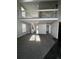 Bright living room with open floorplan, stairs, and railing at 11449 E 1St Ave, Aurora, CO 80010