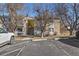 Inviting two-story condo with reserved parking, balconies, stone accents and mature trees at 8555 Fairmount Dr # G208, Denver, CO 80247
