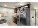 Functional kitchen equipped with stainless steel refrigerator and tile flooring at 8555 Fairmount Dr # G208, Denver, CO 80247
