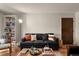 Comfortable living room features a sofa, stylish decor, and wood flooring at 8555 Fairmount Dr # G208, Denver, CO 80247
