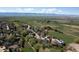 Beautiful aerial view of a residential community with lush greenery and scenic mountains at 2539 Lake Meadow Dr, Lafayette, CO 80026