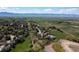 A stunning aerial view of the community, showcasing the green spaces and mountain views at 2539 Lake Meadow Dr, Lafayette, CO 80026