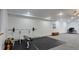 Spacious home gym with weightlifting equipment, ample lighting, and soft carpet and a rubber mat, making it perfect for workouts at 2539 Lake Meadow Dr, Lafayette, CO 80026