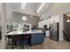 Modern kitchen with stylish blue island, stainless steel appliances, and plenty of counter space at 2539 Lake Meadow Dr, Lafayette, CO 80026
