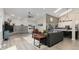Comfortable living room with modern fireplace, plush seating, and an open layout flowing into the kitchen at 2539 Lake Meadow Dr, Lafayette, CO 80026