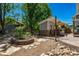 Landscaped backyard with sauna, patio, garden, and mature trees perfect for outdoor living at 902 Jarvis Dr, Erie, CO 80516