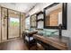 This bathroom showcases dual sinks, granite countertops, and a glass-enclosed shower at 902 Jarvis Dr, Erie, CO 80516