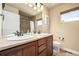 This bathroom features a double vanity and large mirror at 902 Jarvis Dr, Erie, CO 80516