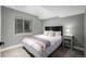 Cozy bedroom with a queen-size bed and soft, neutral decor at 902 Jarvis Dr, Erie, CO 80516