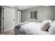 Neutral bedroom featuring a soft bed, closet, and window at 902 Jarvis Dr, Erie, CO 80516