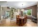 Dining room with a wood table, hardwood floors, and open layout to the living room at 902 Jarvis Dr, Erie, CO 80516