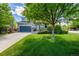 Two-story home boasting a well-manicured lawn and a charming covered front porch at 902 Jarvis Dr, Erie, CO 80516