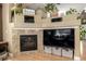 Cozy fireplace with stone surround, integrated media center and decor at 902 Jarvis Dr, Erie, CO 80516