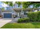 Charming front exterior of a home with a covered porch and well-maintained landscaping at 902 Jarvis Dr, Erie, CO 80516