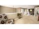 A neutral-toned hallway offers access to various rooms and staircase at 902 Jarvis Dr, Erie, CO 80516