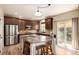 Gourmet kitchen featuring a large island, stainless steel appliances, and granite countertops at 902 Jarvis Dr, Erie, CO 80516