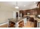 Beautiful kitchen with a center island, wooden cabinets, and stainless steel appliances at 902 Jarvis Dr, Erie, CO 80516