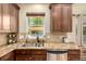 Granite countertops, stainless appliances and a sink with a view make this kitchen a delight at 902 Jarvis Dr, Erie, CO 80516