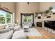 Bright living room with high ceilings, lots of natural light, and a fireplace at 902 Jarvis Dr, Erie, CO 80516