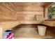 Beautiful wood sauna with bench, window, bucket, and towels providing a tranquil experience at 902 Jarvis Dr, Erie, CO 80516