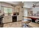 Bright kitchen with stainless appliances, a large window, and a breakfast area with a view at 3766 S Nelson Way, Denver, CO 80235