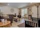 Bright living room with light wood floors, recessed lights, modern decor, and neutral colors at 3766 S Nelson Way, Denver, CO 80235