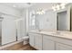 Elegant bathroom with double vanity and a large shower at 4519 Boone Cir, Brighton, CO 80601