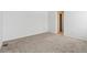 Spacious bedroom with neutral carpeting and an ensuite bathroom at 4519 Boone Cir, Brighton, CO 80601