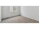 Bright bedroom featuring neutral carpeting and a window at 4519 Boone Cir, Brighton, CO 80601