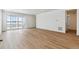 Bright living room with sliding glass doors and wood-look floors at 4519 Boone Cir, Brighton, CO 80601