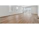 Spacious living room with vinyl flooring and sliding glass doors at 4519 Boone Cir, Brighton, CO 80601