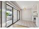 Eat in kitchen with tile floors, sliding doors to patio and white appliances at 6490 S Dayton St # L02, Englewood, CO 80111