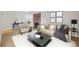 Nicely furnished living room with hardwood floors, fireplace, sofa, chair and accent table at 6490 S Dayton St # L02, Englewood, CO 80111