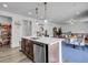 Open kitchen with a large island and modern appliances, seamlessly flowing into the living area at 857 Gold Hill Dr, Erie, CO 80516
