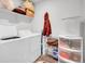 Laundry room with a washer and dryer, storage shelves, and overhead storage at 857 Gold Hill Dr, Erie, CO 80516