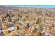 Desirable neighborhood with mature trees and mountain views under a clear blue sky in a prime location at 12286 W Tennessee Ave, Lakewood, CO 80228