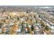 Charming neighborhood with mature trees and mountain views under a clear blue sky in a desirable location at 12286 W Tennessee Ave, Lakewood, CO 80228
