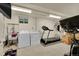 Spacious basement laundry and workout area with storage at 12286 W Tennessee Ave, Lakewood, CO 80228