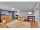 Finished basement with a bar, seating area, and a refrigerator, perfect for entertaining at 12286 W Tennessee Ave, Lakewood, CO 80228