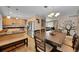 Inviting dining area with wooden table, chairs, and a decorative tree mural for stylish and comfortable gatherings at 12286 W Tennessee Ave, Lakewood, CO 80228