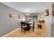 Cozy dining room featuring wood floors, a table with seating for six, and contemporary lighting at 12286 W Tennessee Ave, Lakewood, CO 80228
