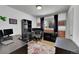 Bright home office featuring multiple desks, ample workspace, and natural light from the window at 12286 W Tennessee Ave, Lakewood, CO 80228
