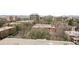 This aerial view highlights the surrounding neighborhood and city buildings at 1029 E 8Th Ave # 901, Denver, CO 80218