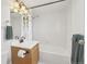 Bathroom features an updated vanity, wood cabinets, modern fixtures, and a shower and tub combination at 1029 E 8Th Ave # 901, Denver, CO 80218
