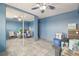 Bright bedroom features blue walls, unique ceiling fan, and mirrored closet doors providing extra space and light at 1029 E 8Th Ave # 901, Denver, CO 80218