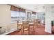 Bright dining area offers stunning city views, complemented by seating and modern decor at 1029 E 8Th Ave # 901, Denver, CO 80218