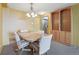 Comfortable dining room with wooden table and carpet floors at 1029 E 8Th Ave # 901, Denver, CO 80218