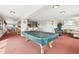 Recreation area includes a pool table, seating, and kitchenette for entertainment and relaxation at 1029 E 8Th Ave # 901, Denver, CO 80218
