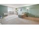 Cozy living room features carpet floors, relaxing chaise lounge, and access to the balcony at 1029 E 8Th Ave # 901, Denver, CO 80218